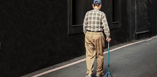 elderly man, older adult, senior, quad cane, four prong cane, balance issues, walking steadily, mobility equipment